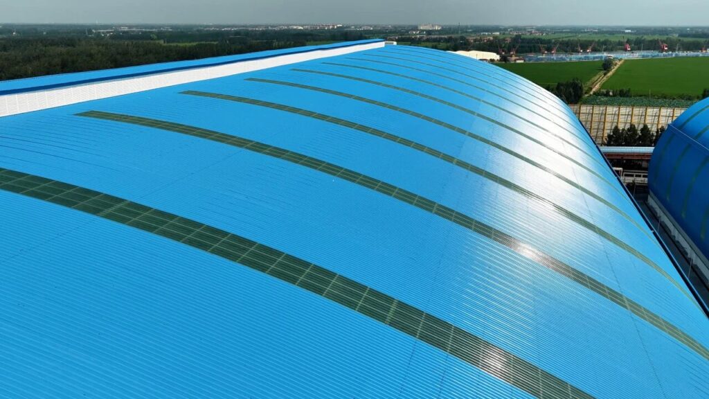 Large span industrial roofing system using coated steel sheets