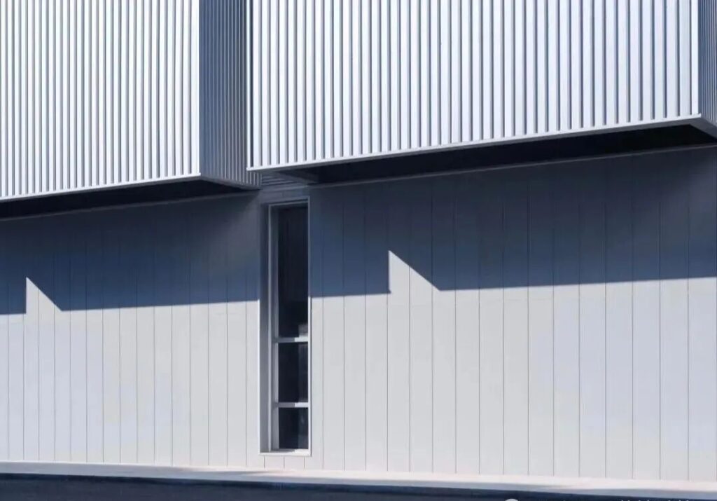 Metal wall cladding panels for industrial buildings